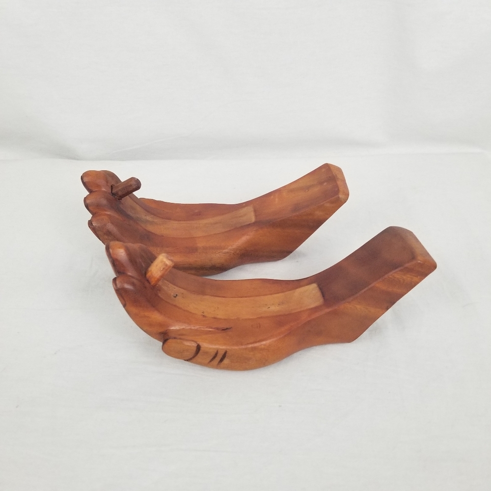 Two wooden hands wall art
